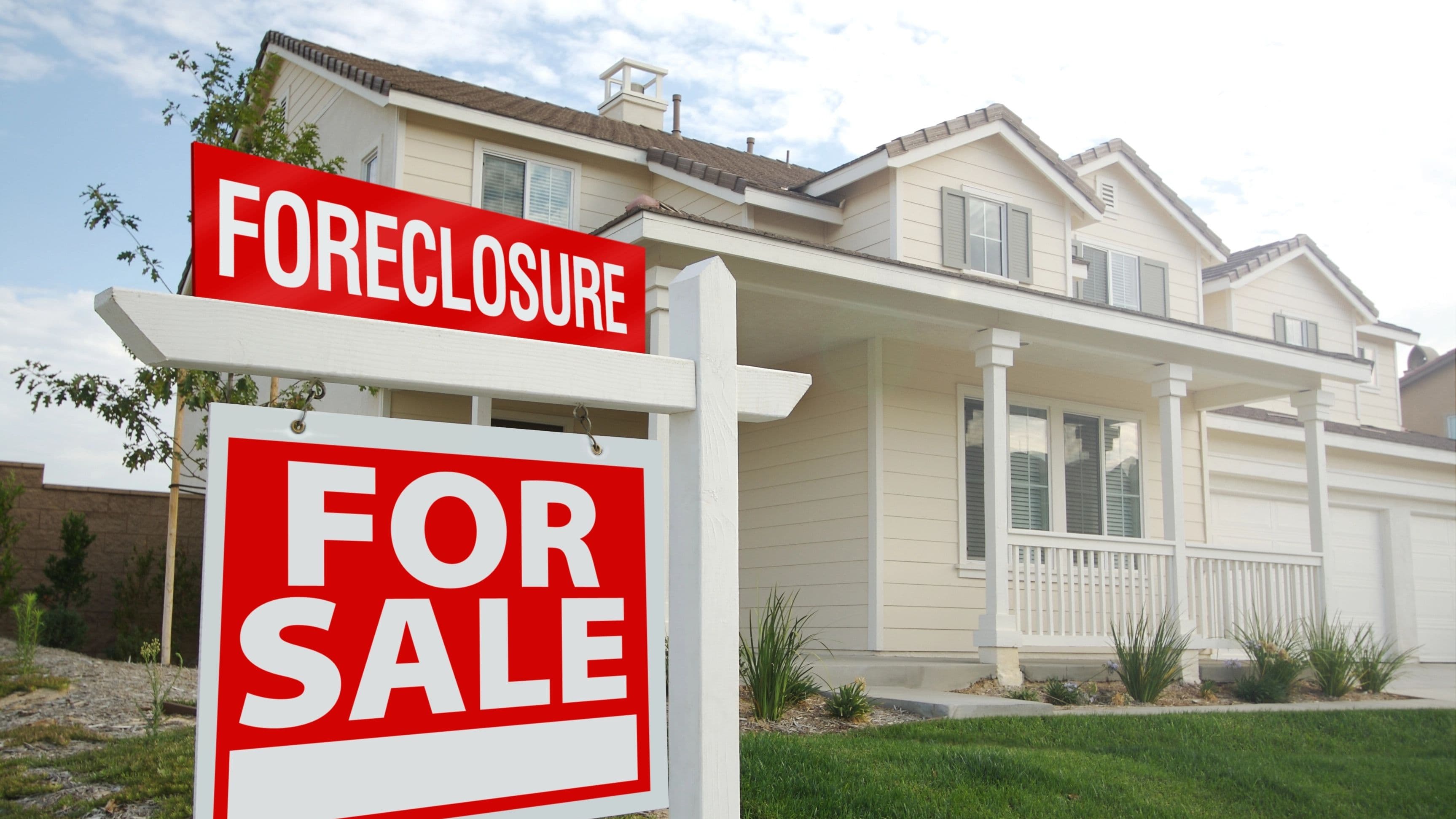 House in Foreclosure has sign in front.